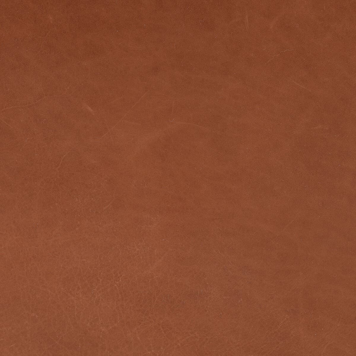 Close up of Four Hands Nino Ottoman in Dakota Tobacco on a white background