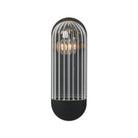 Four Hands Odyssey Sconce in Black Gunmetal on a white background at Addison West