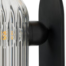 Close up of Four Hands Odyssey Sconce in Black Gunmetal on a white background at Addison West