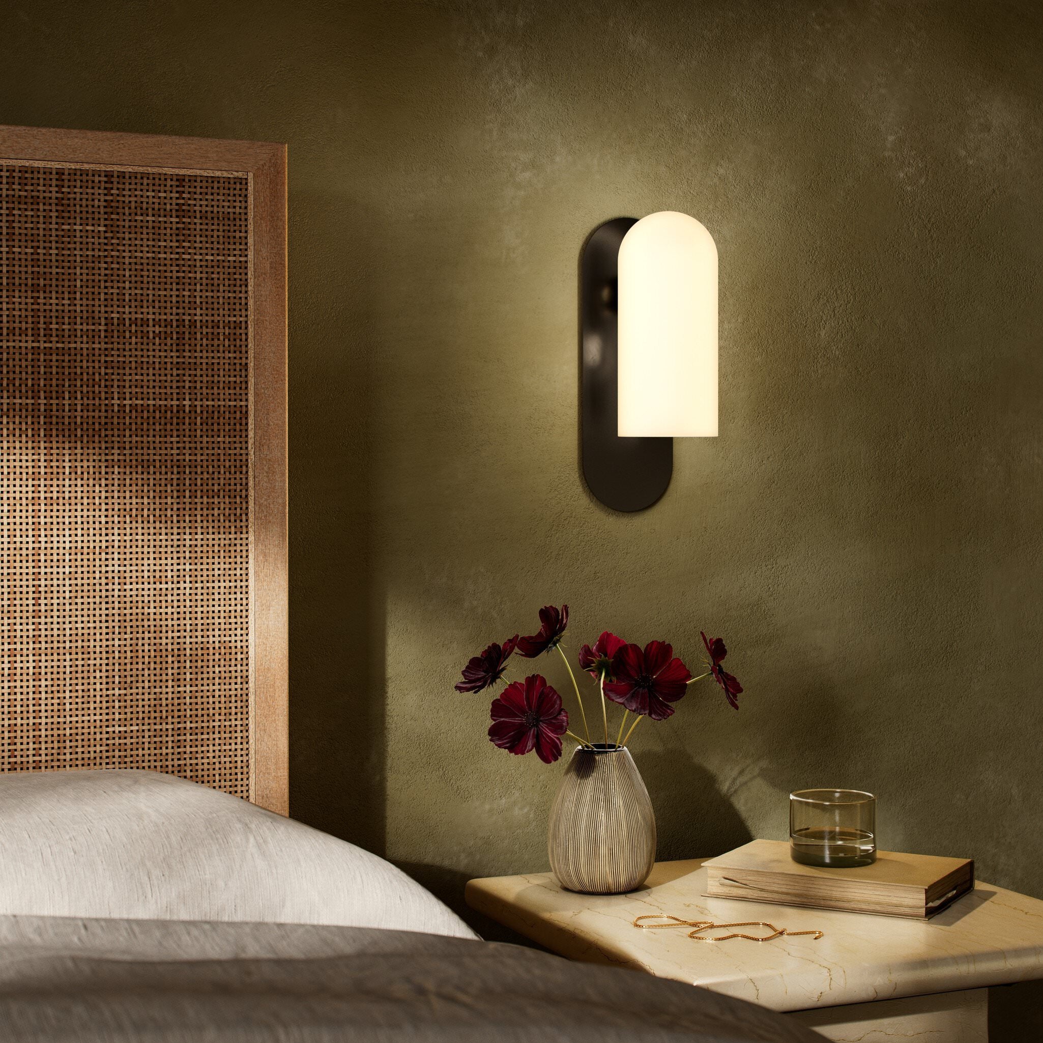 Four Hands Odyssey Sconce in Black Gunmetal with Opal Matte Glass in bedroom at Addison West.