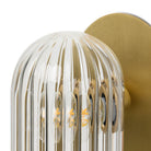 Close up of Four Hands Odyssey Sconce in Burnished Brass on a white background at Addison West