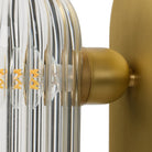 Close up of Four Hands Odyssey Sconce in Burnished Brass on a white background at Addison West