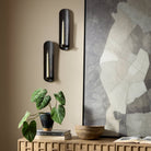 Four Hands Pilla Wall Mounted Candle Holder Set in Distressed Bronze on  beige wall at Addison West