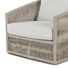 Close up of Four Hands Porto Outdoor Swivel Chair in Alessi Linen on a white background at Addison West
