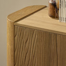 Close up of Four Hands Radius Sideboard in Light Blonde Sungkai Veneer in a living room at Addison West