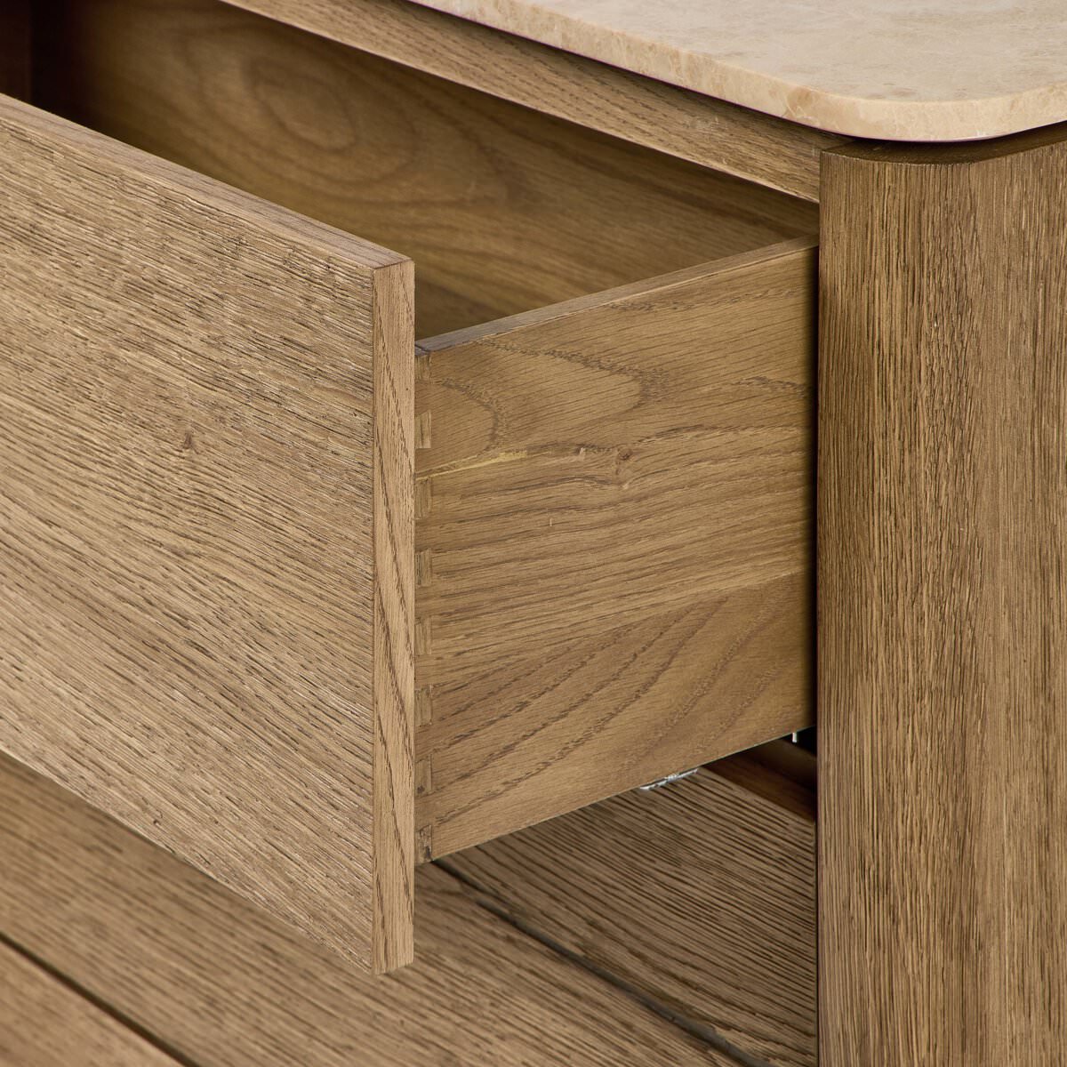 Close up of Four Hands Raleigh 6 Drawer Dresser in Worn Oak Veneer on a white background at Addison West