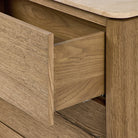 Close up of Four Hands Raleigh 6 Drawer Dresser in Worn Oak Veneer on a white background at Addison West
