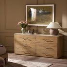 Four Hands Raleigh 6 Drawer Dresser in Worn Oak Veneer in a bedroom at Addison West