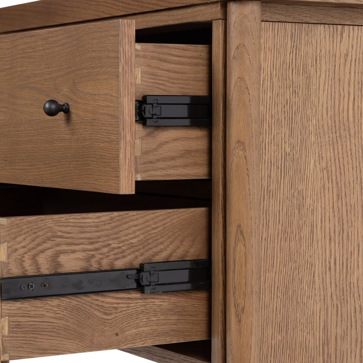 Close up of drawers of Four Hands Roark Nightstand on a white background