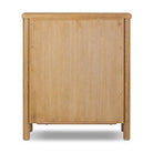 Back of Four Hands Roark Tall Dresser in Amber Oak on a white background at Addison West