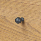 Close up of Four Hands Roark Tall Dresser in Amber Oak  at Addison West