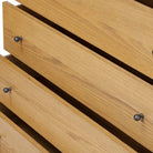 Close up of Four Hands Roark Tall Dresser in Amber Oak on a white background at Addison West