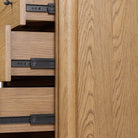 Close up of Four Hands Roark Tall Dresser in Amber Oak on a white background at Addison West