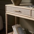 Close up of Four Hands Rosenell Console Table 60" in Natural Oak Solid in a green living room at Addison West