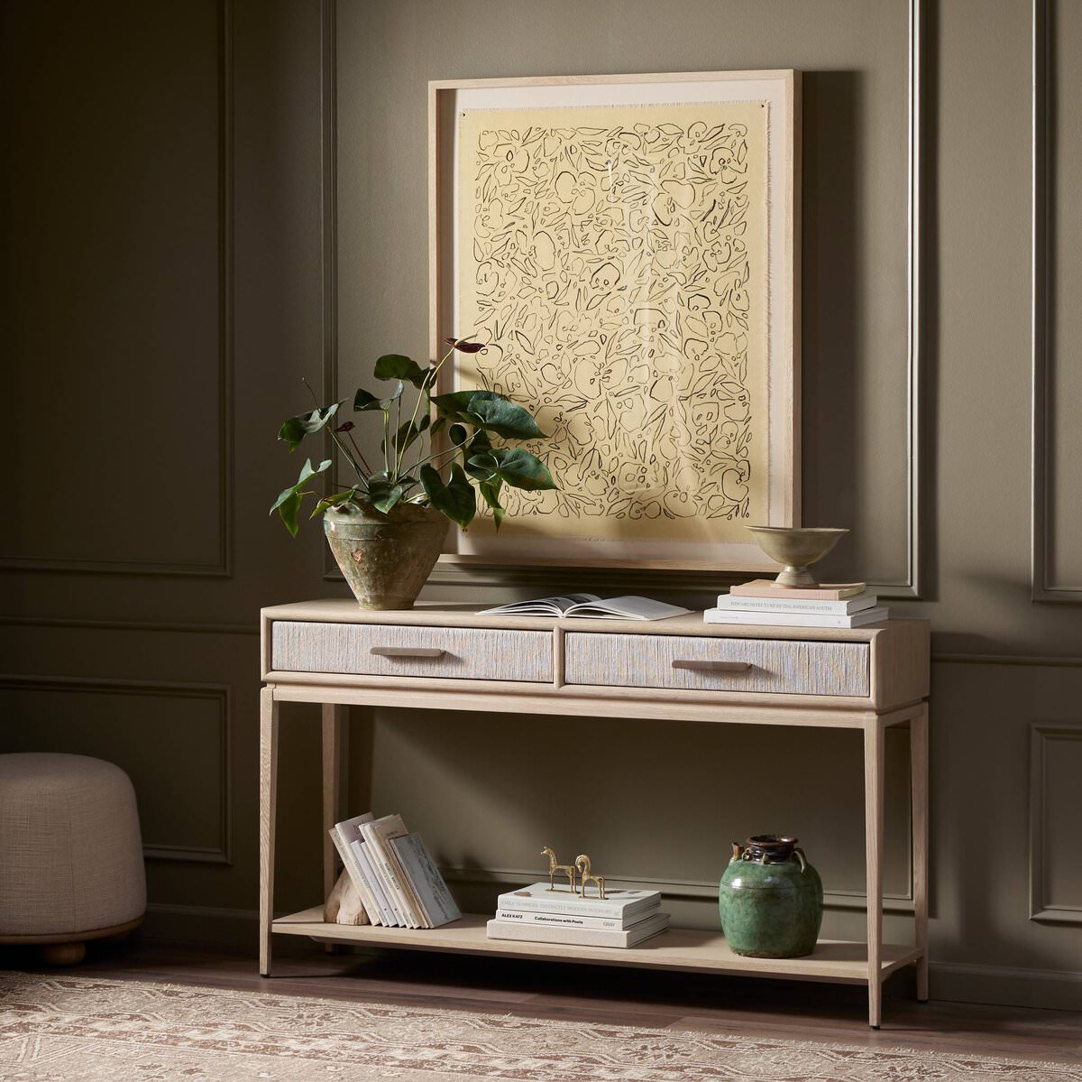 Four Hands Rosenell Console Table 60" in Natural Oak Solid in a dark green living room at Addison West