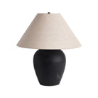 Four Hands Russo Table Lamp in Aged Black Terracotta on a white background at Addison West