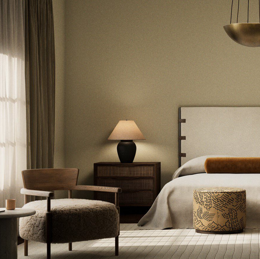 Four Hands Russo Table Lamp in Aged Black Terracotta on a nightstand at Addison West