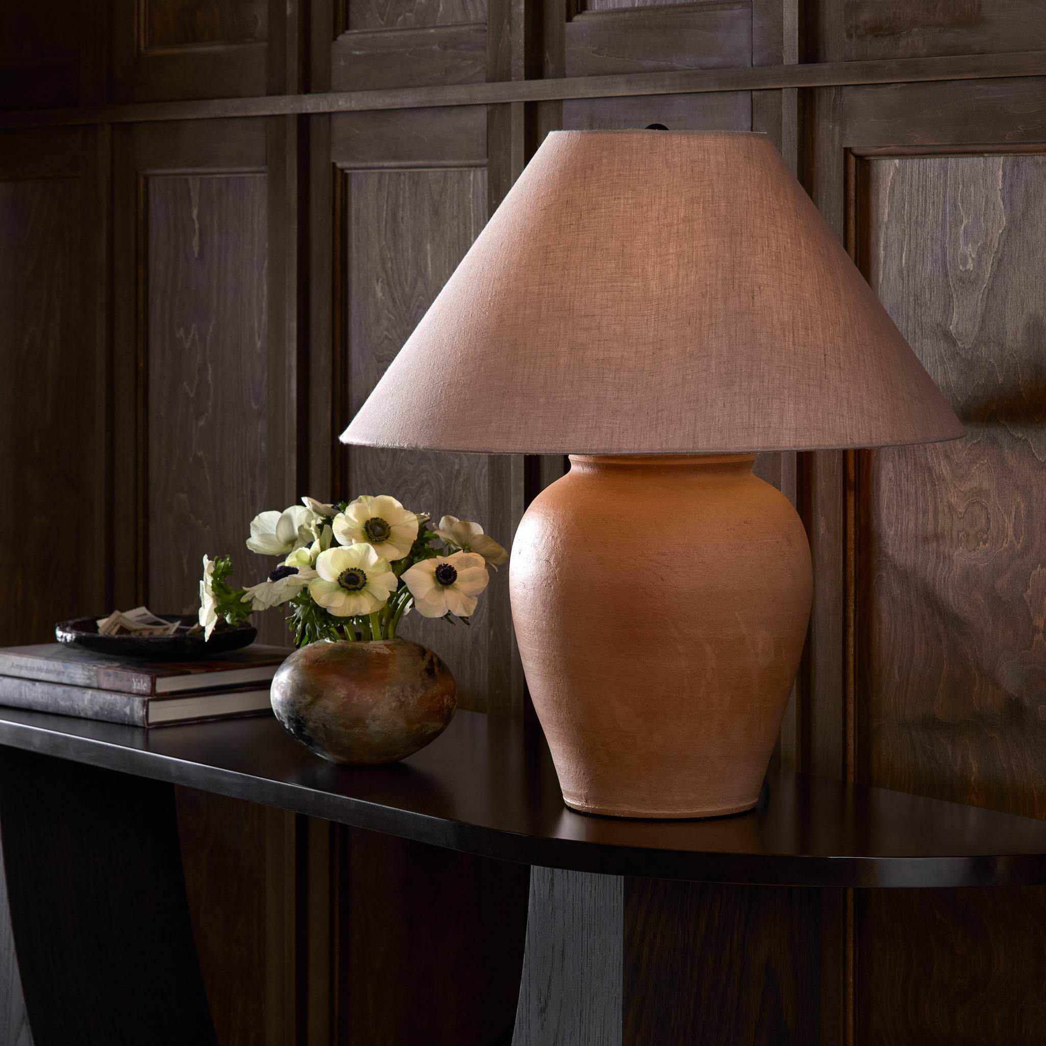 Four Hands Russo Table Lamp in Aged Natural Terracotta on a table at Addison West