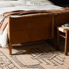 Close up of Four Hands Salado Bed in Heirloom Sienna, Queen in a bedroom at Addison West