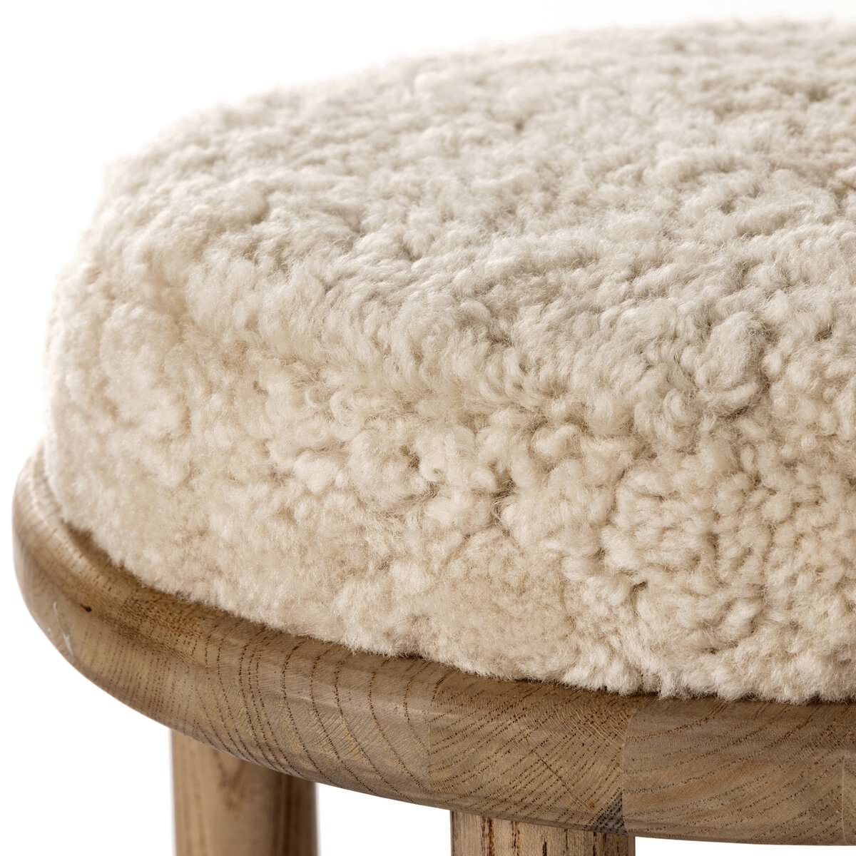 Close up of Four Hands Saldino Counter Stool in Beige Shearling on a white background at Addison West