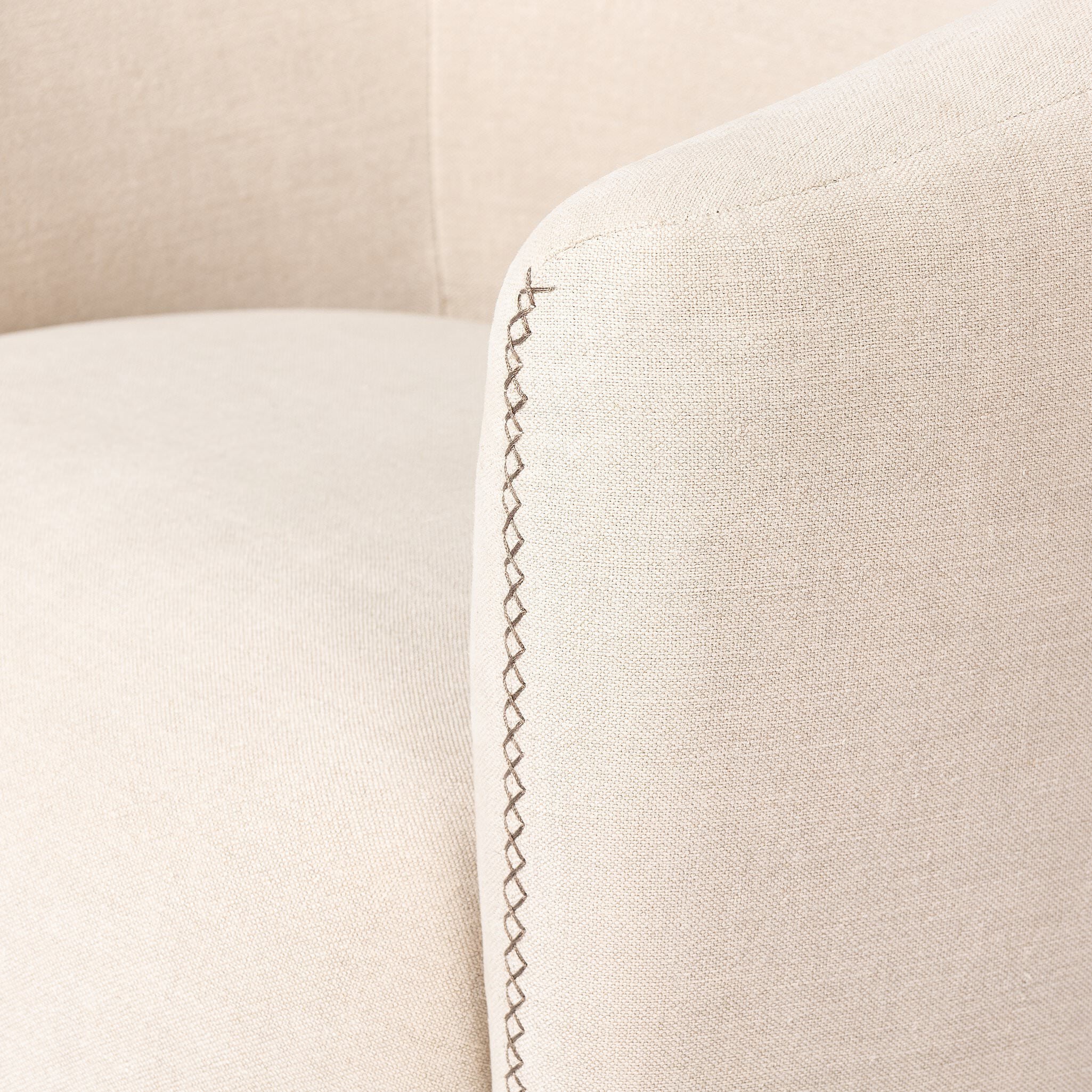 Close up of Four Hands Salena Swivel Chair in Broadway Dune on a white background at Addison West