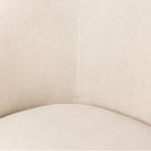 Close up of Four Hands Salena Swivel Chair in Broadway Dune on a white background at Addison West