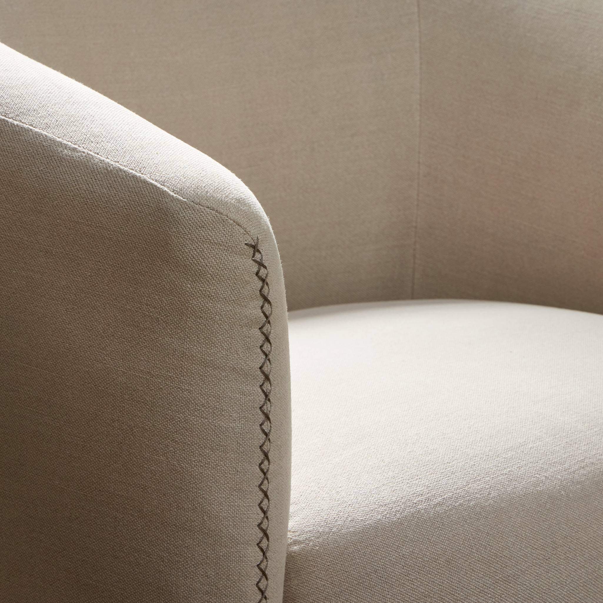 Close up of Four Hands Salena Swivel Chair in Broadway Dune on a white background at Addison West