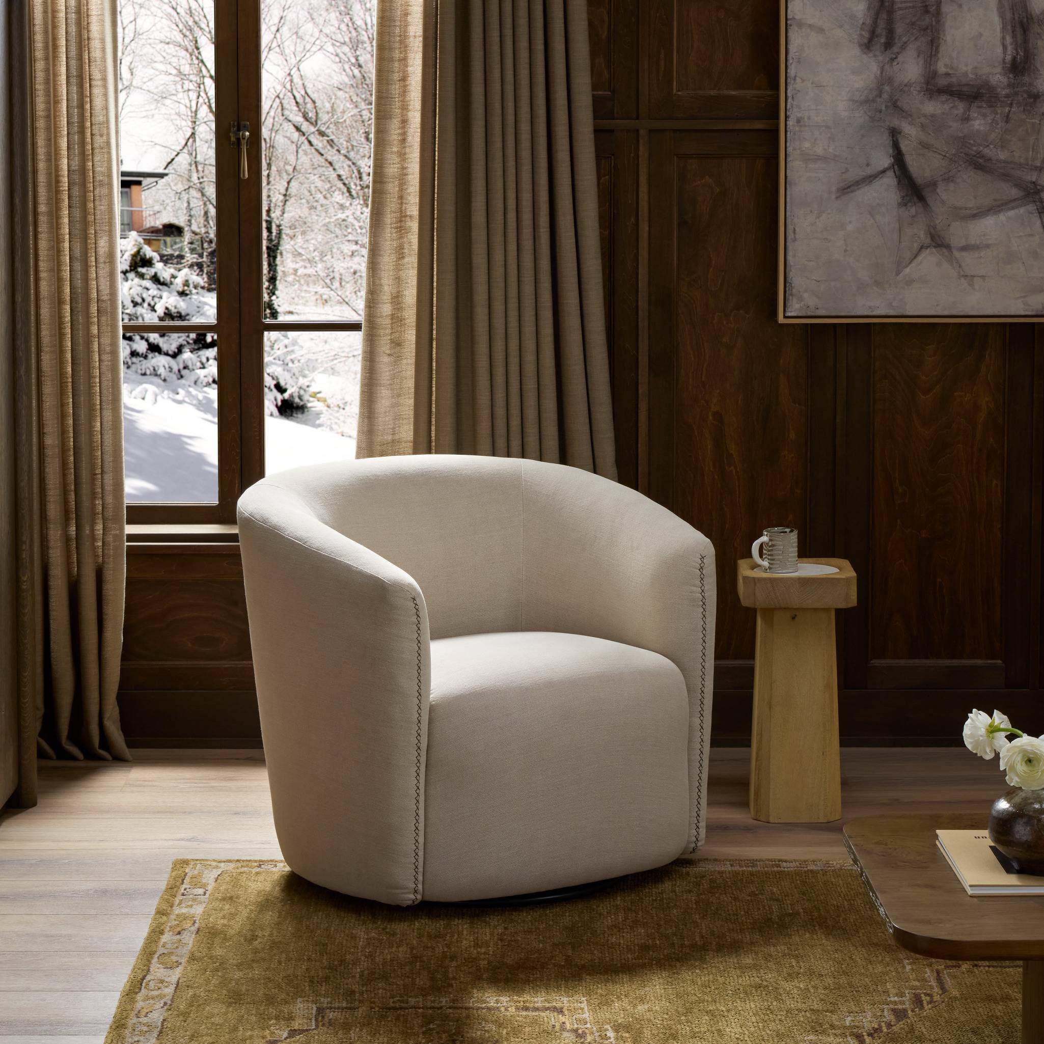 Four Hands Salena Swivel Chair in Broadway Dune in a living room at Addison West