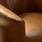 Close up of Four Hands Salena Swivel Chair in Sonoma Chestnut on a white background at Addison West