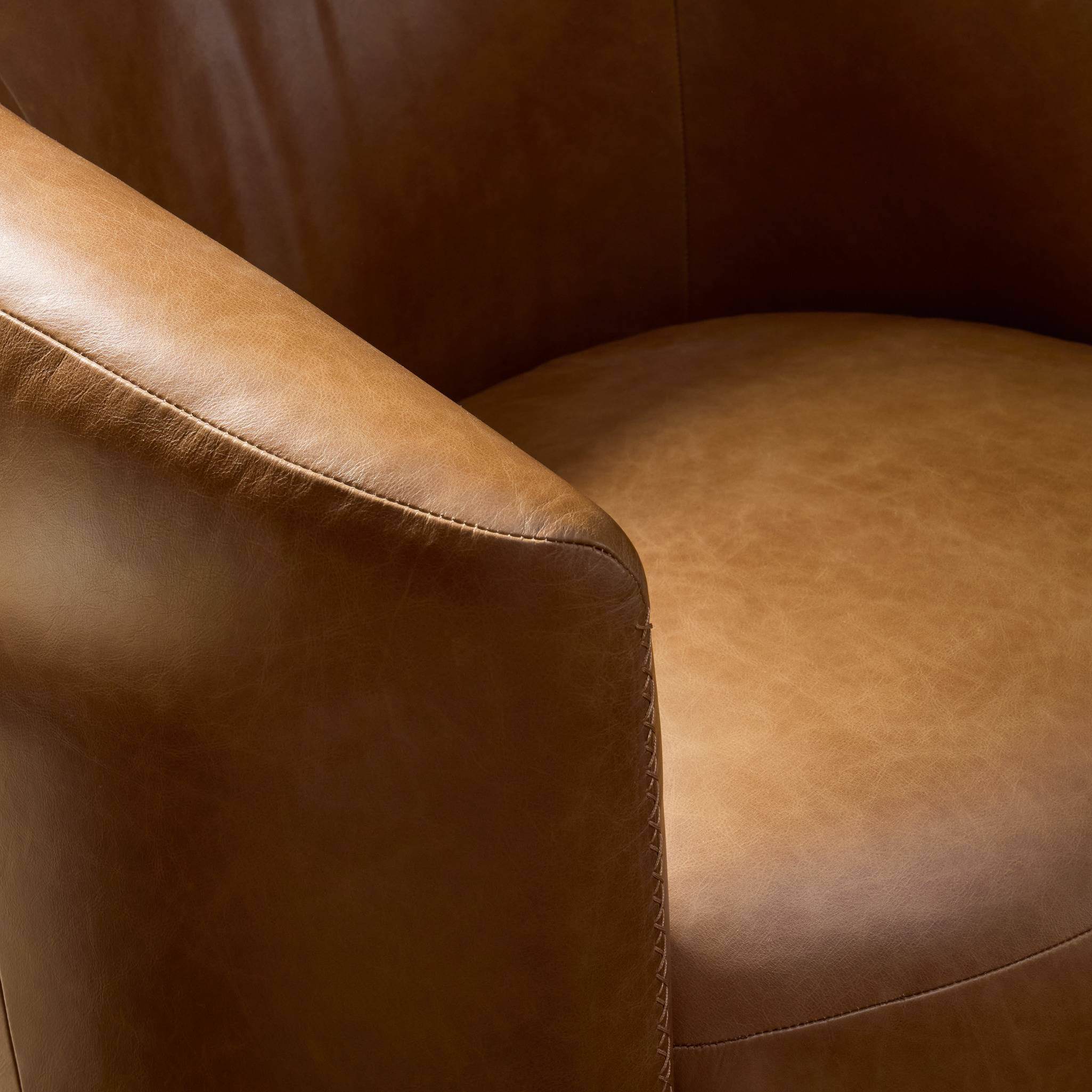 Close up of Four Hands Salena Swivel Chair in Sonoma Chestnut on a white background at Addison West