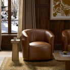 Four Hands Salena Swivel Chair in Sonoma Chestnut in a living room at Addison West