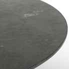 Close up of Four Hands Sargon Dining Table in Bluestone on a white background at Addison West