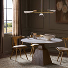 Four Hands Sargon Dining Table in Honed White Marble in a dining room at Addison West
