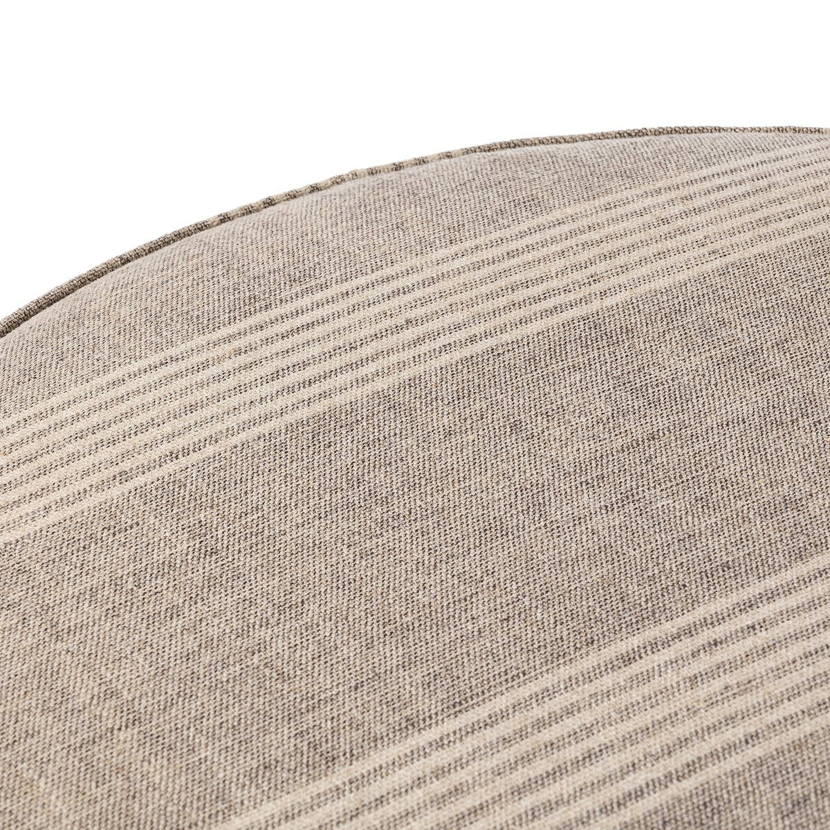 Close up of Four Hands Sinclair Large Round Ottoman in Manchester Flint on a white background at Addison West