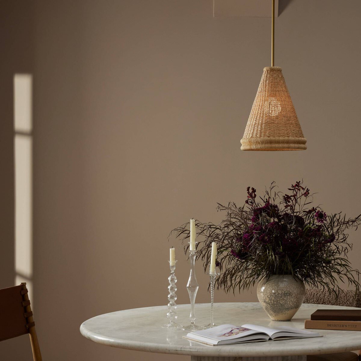 Four Hands Small Riata Pendant in Light Raffia in a dining room at Addison West
