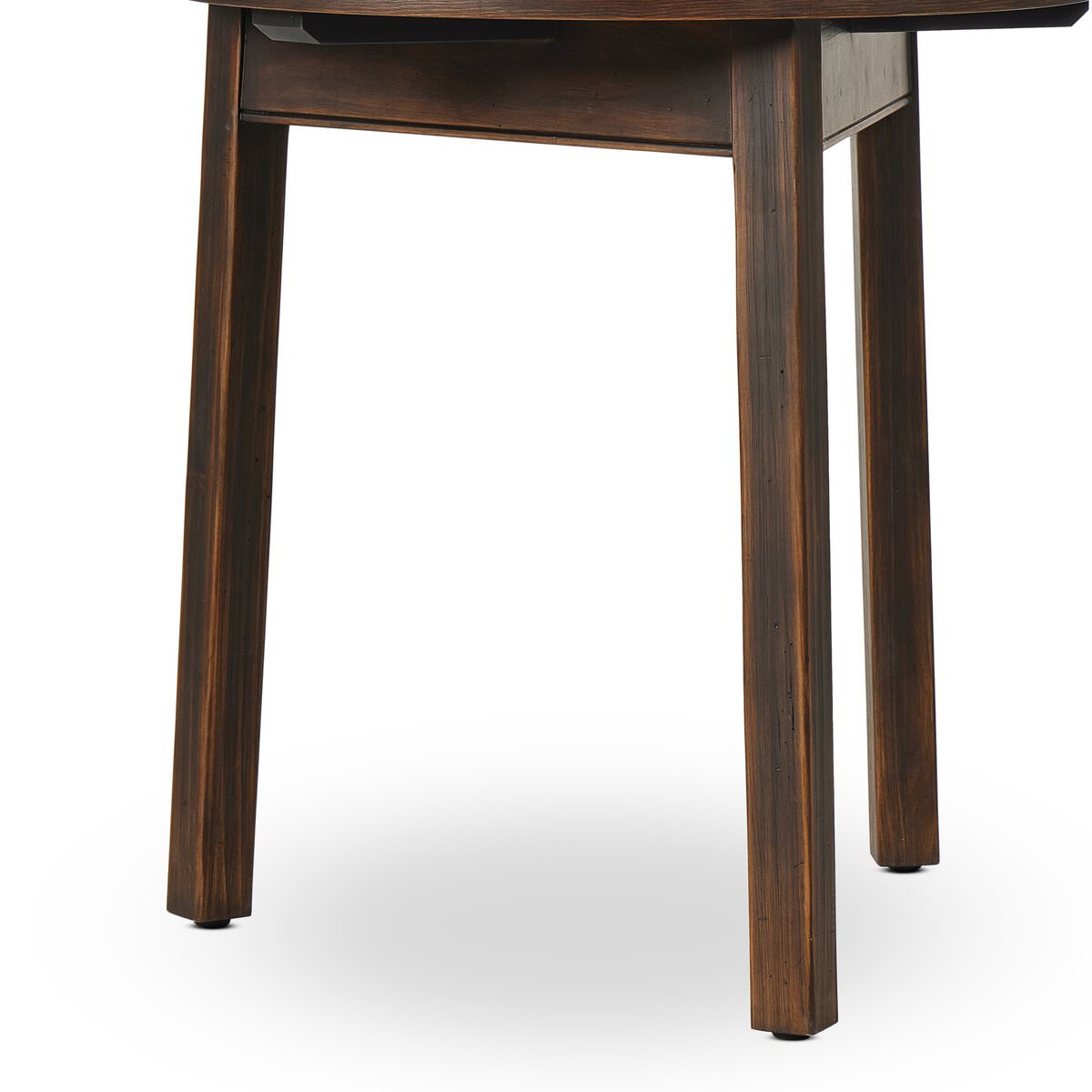Close up of legs of Four Hands The Pimms Table in Aged Brown Finish on a white background