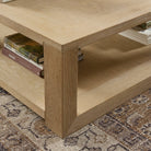 Close up of Four Hands Thomas Square Coffee Table in Bleached Oak Veneer on a rug at Addison West