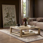 Four Hands Thomas Square Coffee Table in Bleached Oak Veneer in a neutral living room at Addison West