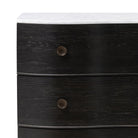 Close up of Four Hands Tiago Marble Chest in Distressed Black on a white background