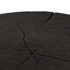 Close up of Four Hands Tino End Table in Rubbed Black on a white background