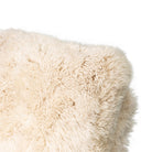 Close up of Four Hands Tobin Chair in Champagne Mongolian Fur on white background at Addison West.