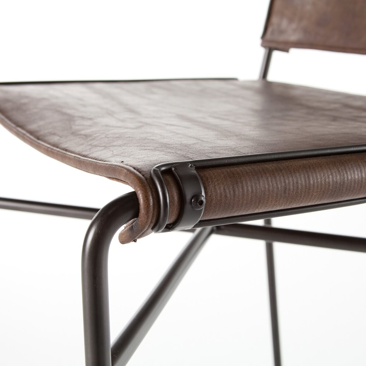 Close up of Four Hands Wharton Bar Stool in Distressed Brown on a white background at Addison West