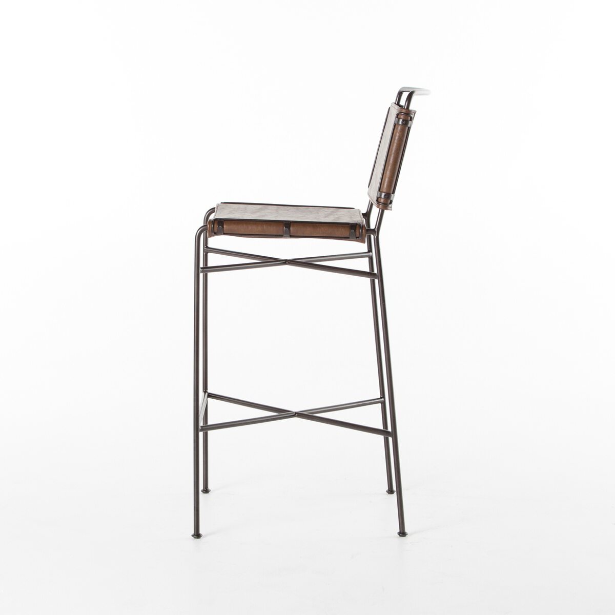Side of Four Hands Wharton Bar Stool in Distressed Brown on a white background at Addison West