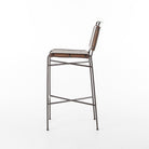 Side of Four Hands Wharton Bar Stool in Distressed Brown on a white background at Addison West