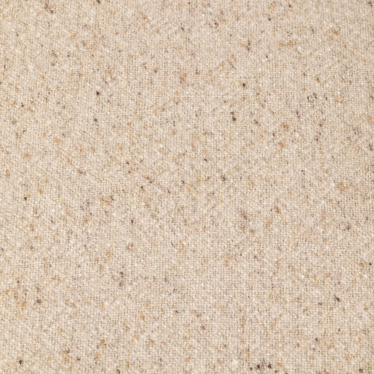 Close up of fabric seat of Four Hands Xavier Dining Armchair in Hasselt Taupe on a white background