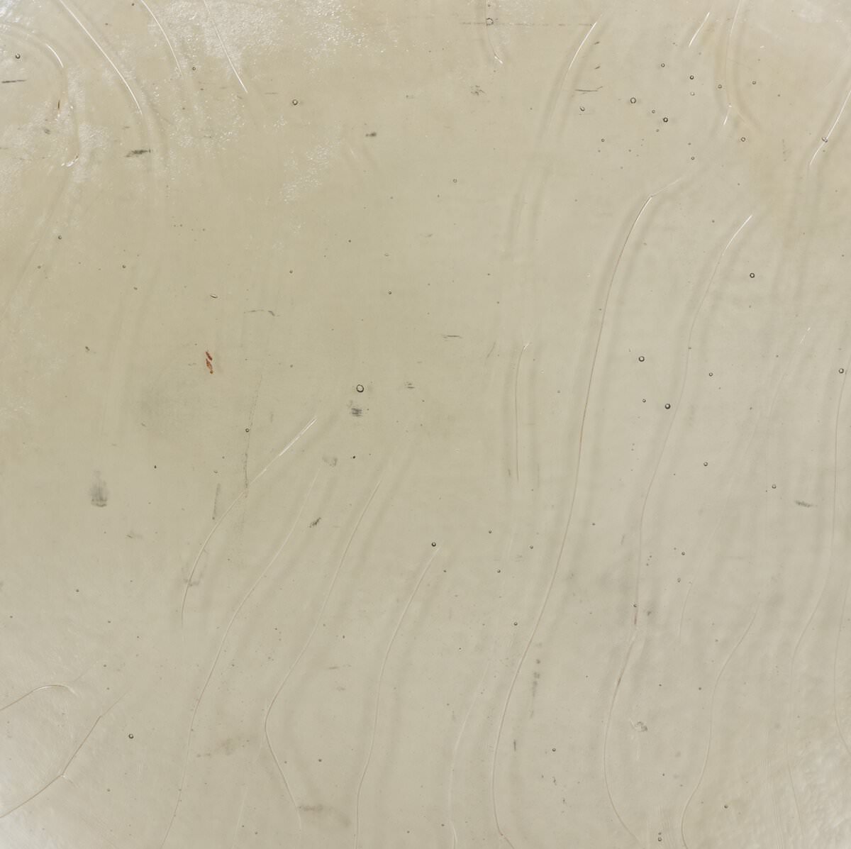 Close up of Four Hands Yoko Grand Coffee Table in Clear Cast Glass on a white background at Addison West