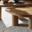 Four Hands Zion Nesting Coffee Tables in Natural Oak in living room at Addison West.