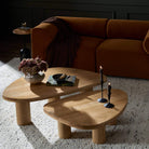 Four Hands Zion Nesting Coffee Tables in Natural Oak in living room at Addison West.