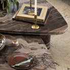 Four Hands Zion Nesting Coffee Tables in Rocky Brown Marble in living room at Addison West.