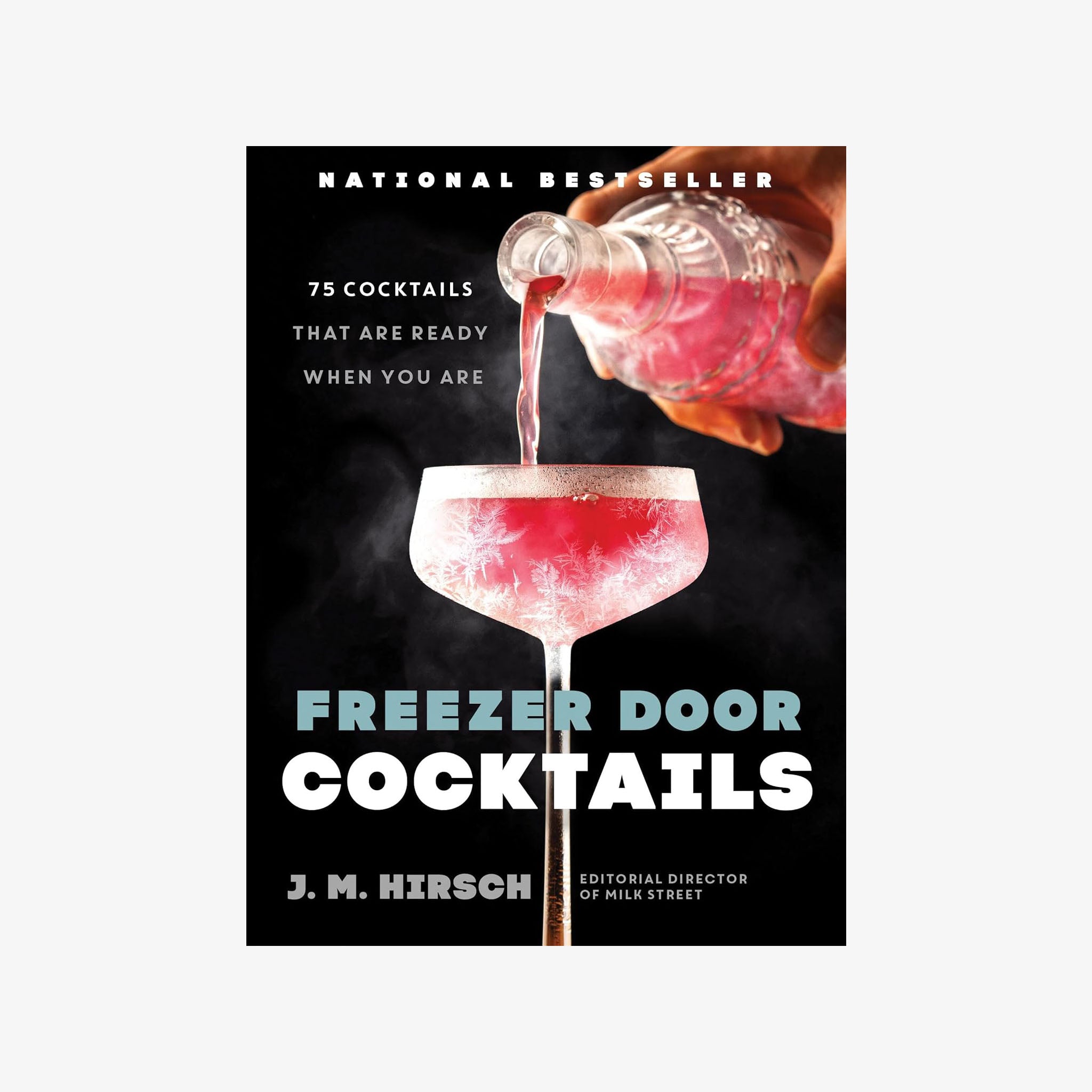Front cover of book titled 'Freezer Door Cocktails' with a black cover and a frozen cocktail on the cover